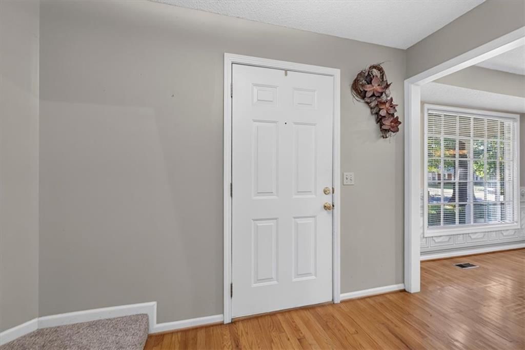 White trim, mixed-finish hardware and gray walls at 10228 Caenen Drive, Lenexa, KS 66215
