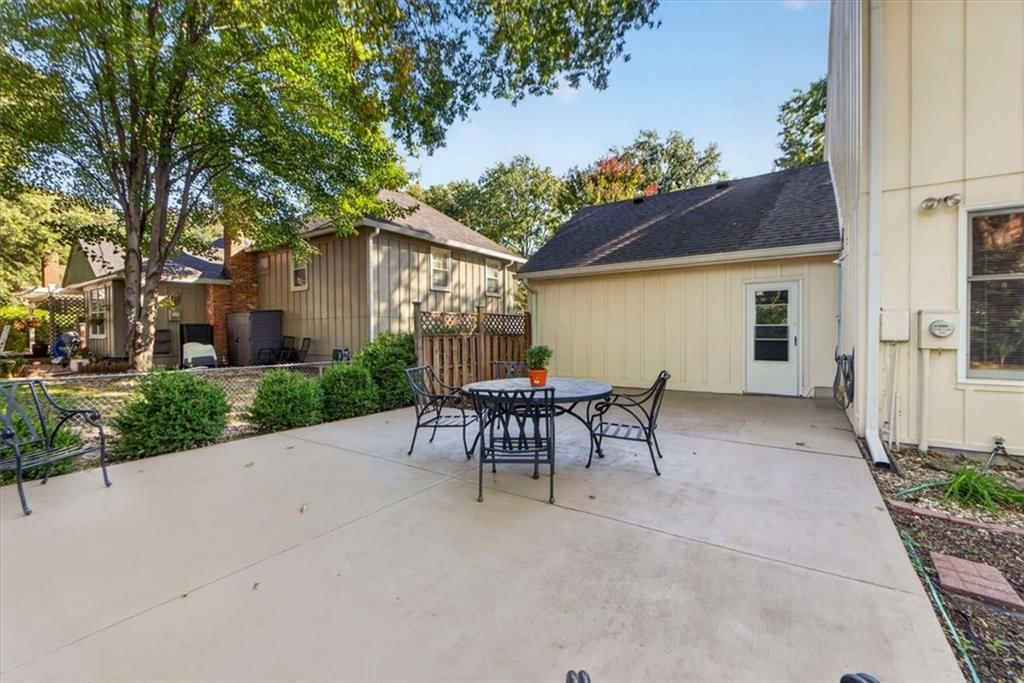 Deck, big backyard and fenced yard at 10228 Caenen Drive, Lenexa, KS 66215