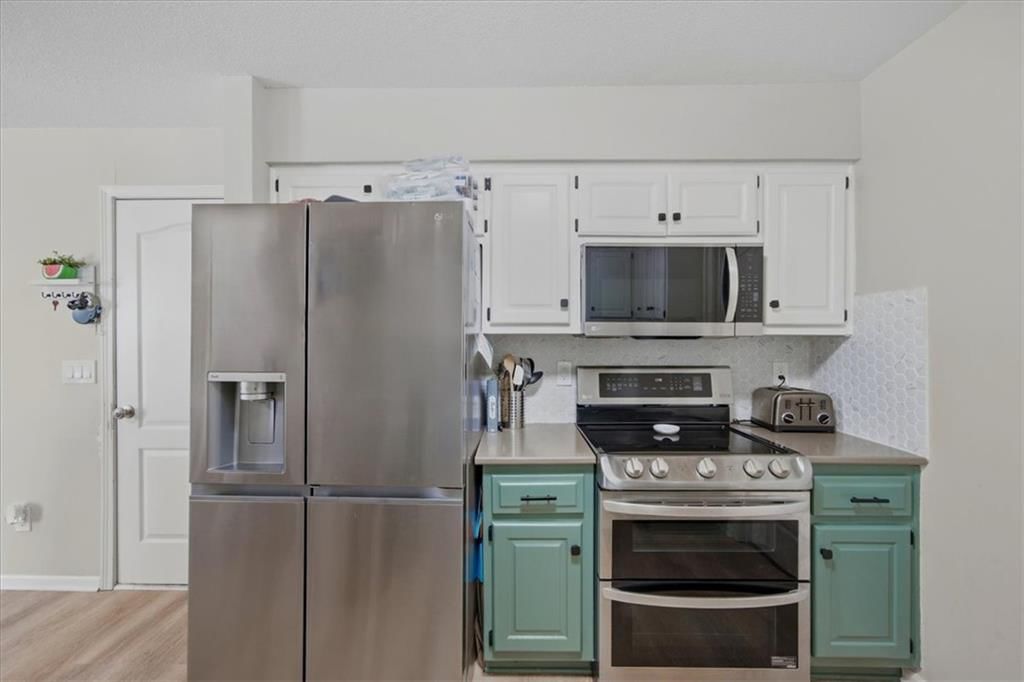 Photo 7: stainless steel appliances, 1205 E Sleepy Hollow Drive, Olathe, KS 66062
