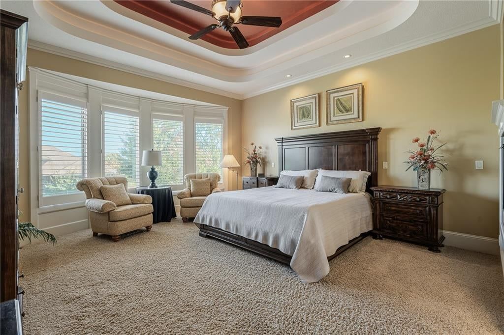 Main-floor primary bedroom, bedroom sitting area and carpet at 8959 Chestnut Street, Lenexa, KS 66220