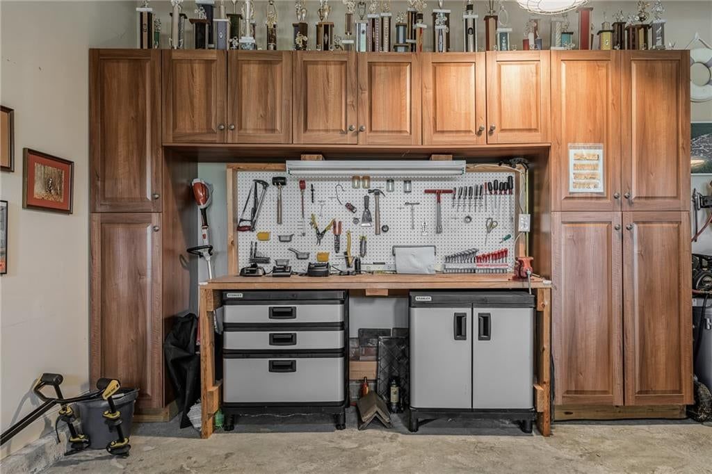 Outdoor kitchen, covered patio and concrete patio at 8959 Chestnut Street, Lenexa, KS 66220