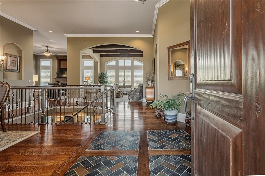 Hardwood floors, black hardware and white trim at 8959 Chestnut Street, Lenexa, KS 66220