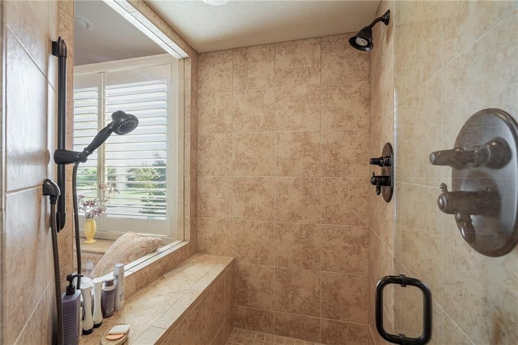 Tile floors, walk-in shower and tiled shower at 8959 Chestnut Street, Lenexa, KS 66220