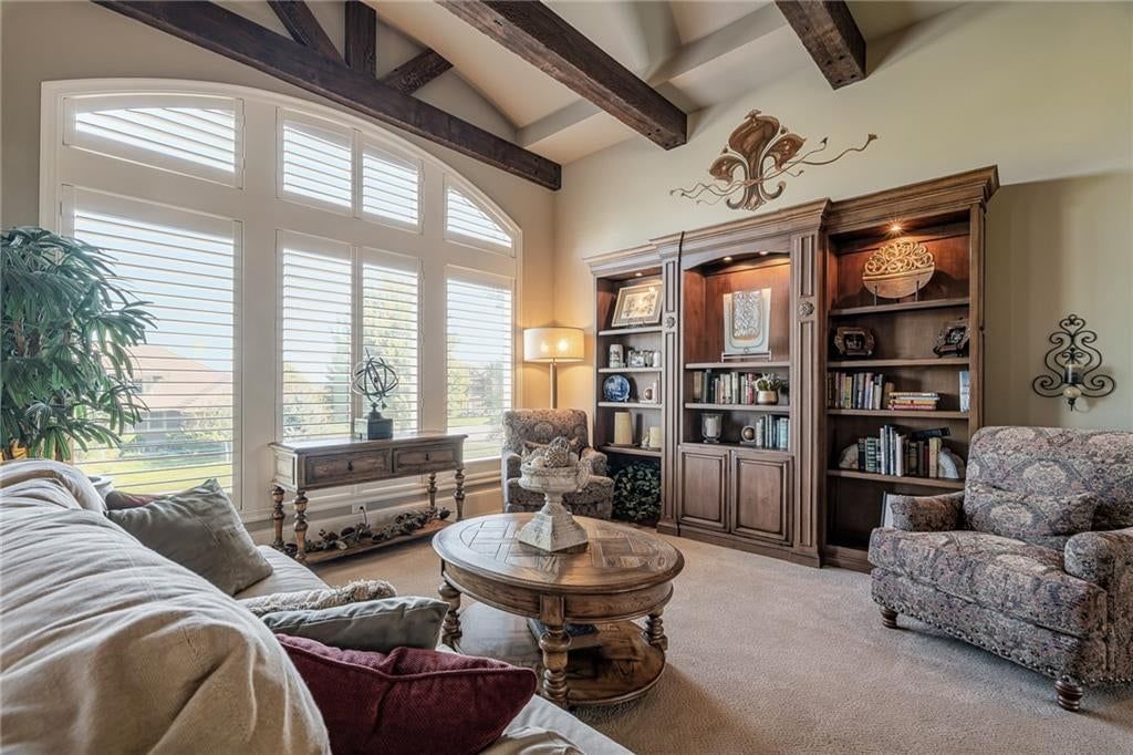 Tall ceilings, ceiling beams and wall of windows at 8959 Chestnut Street, Lenexa, KS 66220