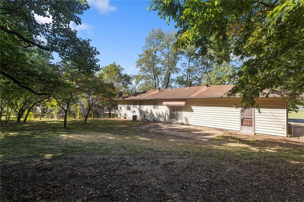 Big backyard and mature trees at 8431 Glenwood Street, Overland Park, KS 66212