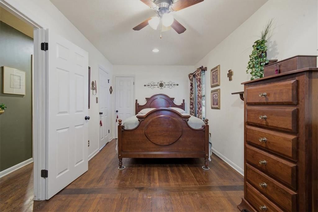Main-floor primary bedroom at 3501 Woodbury Street, Independence, MO 64055