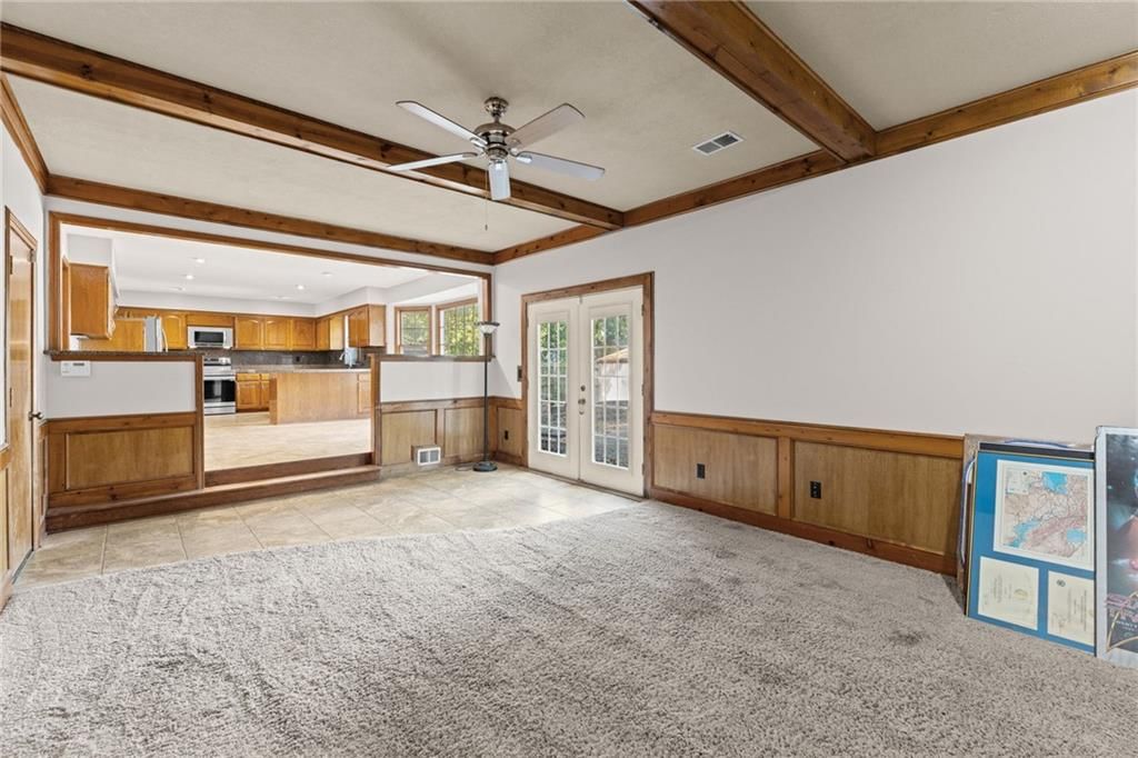 Open floor plan, wainscoting or board and batten and shiplap / paneling at 14804 W 84th Terrace, Lenexa, KS 66215