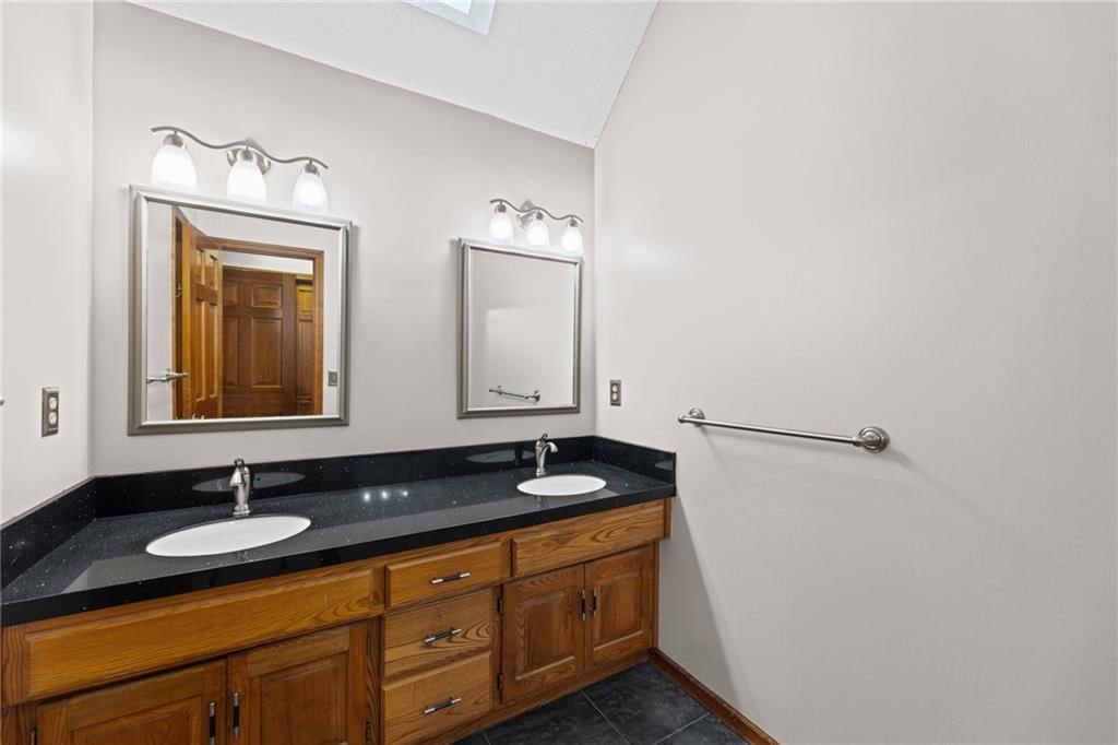 Double vanity and wood vanity at 14804 W 84th Terrace, Lenexa, KS 66215