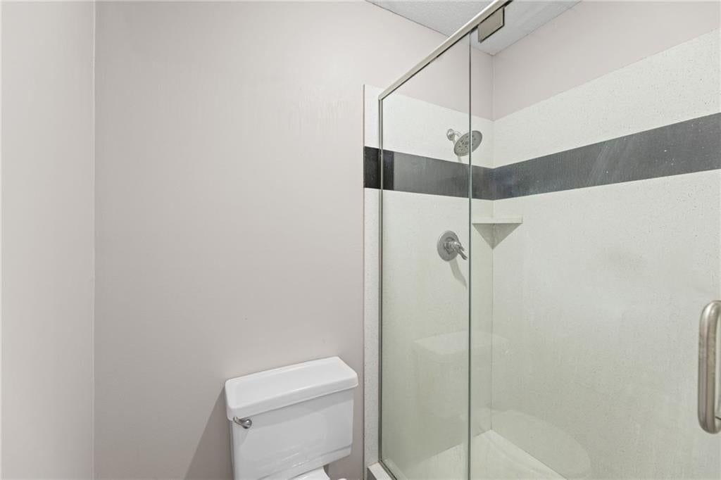 Walk-in shower and tiled shower at 14804 W 84th Terrace, Lenexa, KS 66215