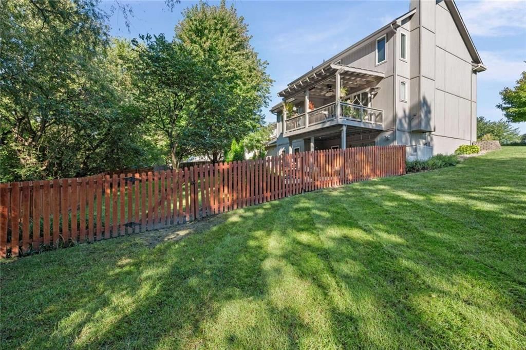 Fire pit and concrete patio at 211 Surrey Court, Smithville, MO 64089