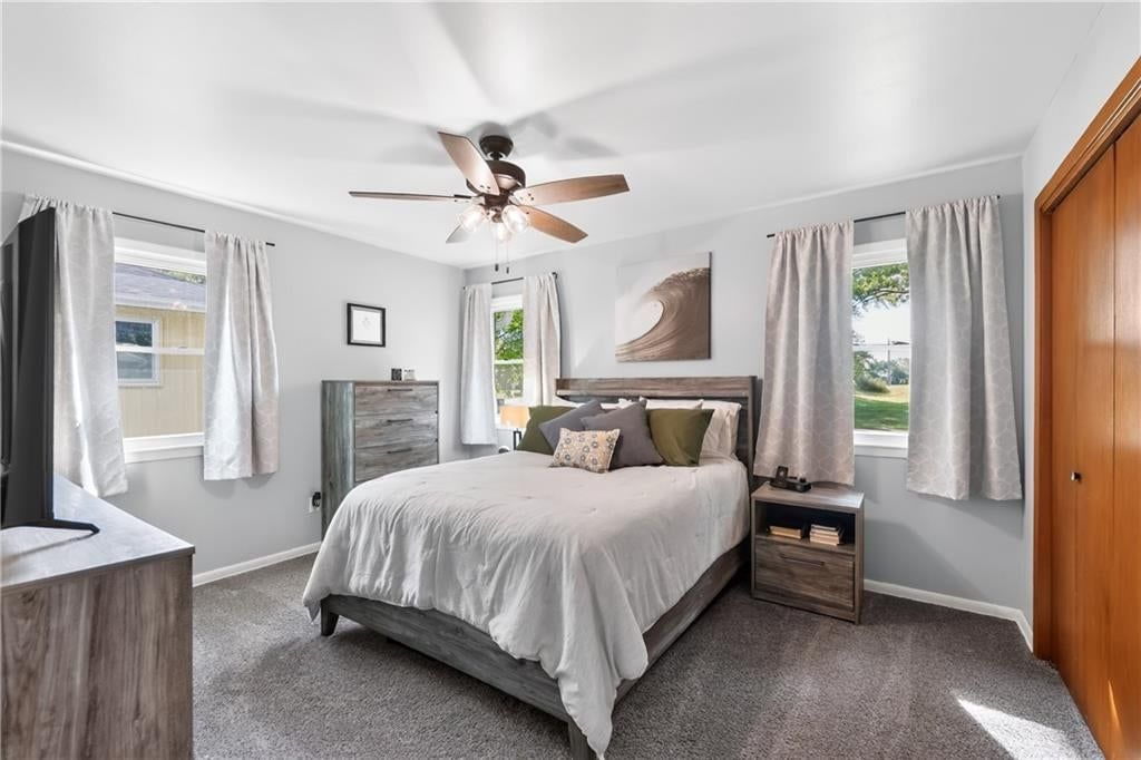 Main-floor primary bedroom at 114 W 8th Street, Kearney, MO 64060