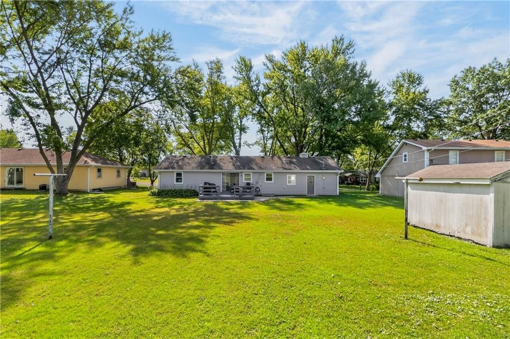 Big backyard, mature trees and flat lot at 114 W 8th Street, Kearney, MO 64060