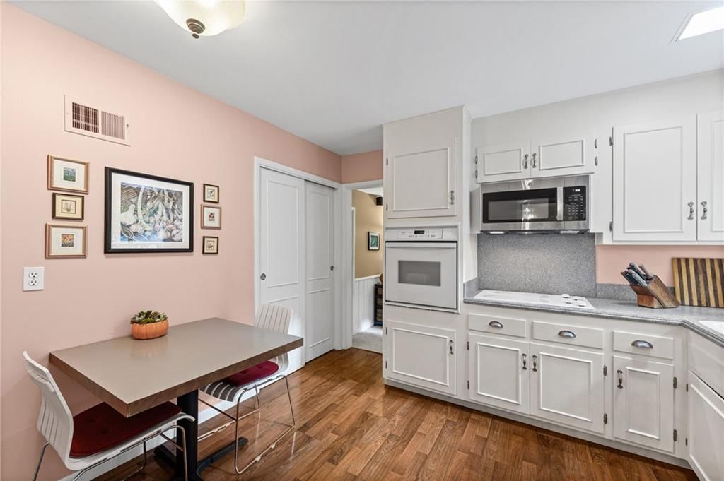 Breakfast nook, updated kitchen and subway tile backsplash at 6527 Maple Drive, Mission, KS 66202