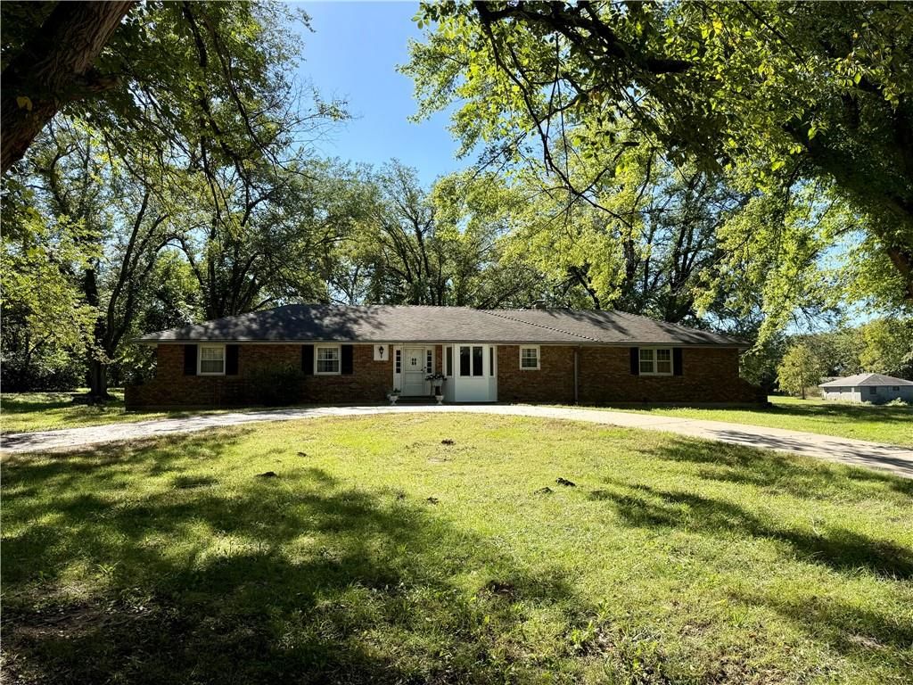 Big backyard, mature trees and circular driveway at 20425 W 103rd Terrace, Olathe, KS 66061