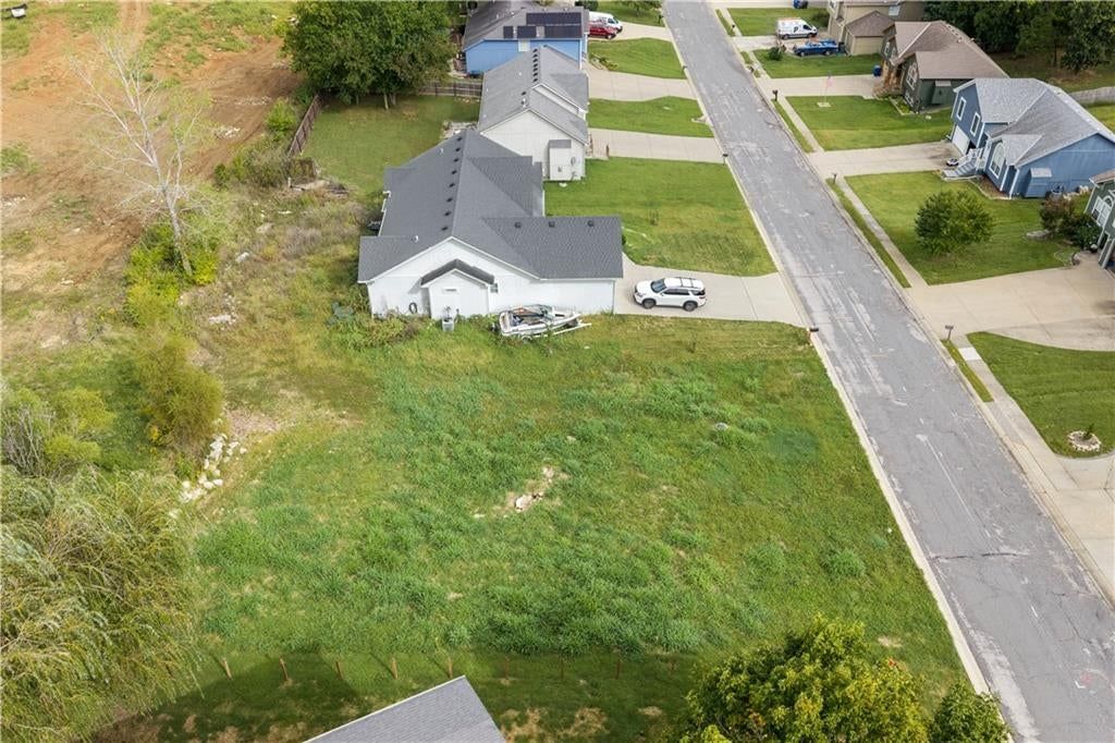 Photo 5 of 6 - 104 E WHISPERING HILLS Boulevard, Lone Jack, MO 64070