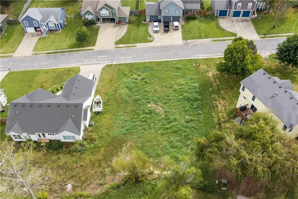 Photo 6 of 6 - 104 E WHISPERING HILLS Boulevard, Lone Jack, MO 64070