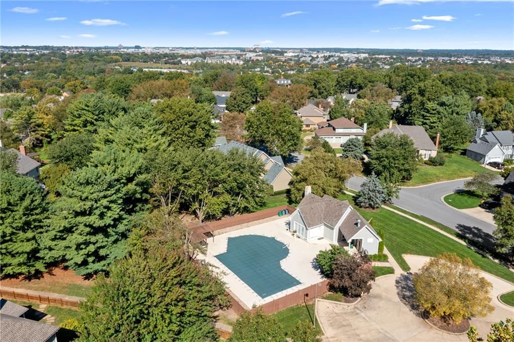 Corner lot, fenced yard and mature trees at 12808 Sherwood Drive, Leawood, KS 66209
