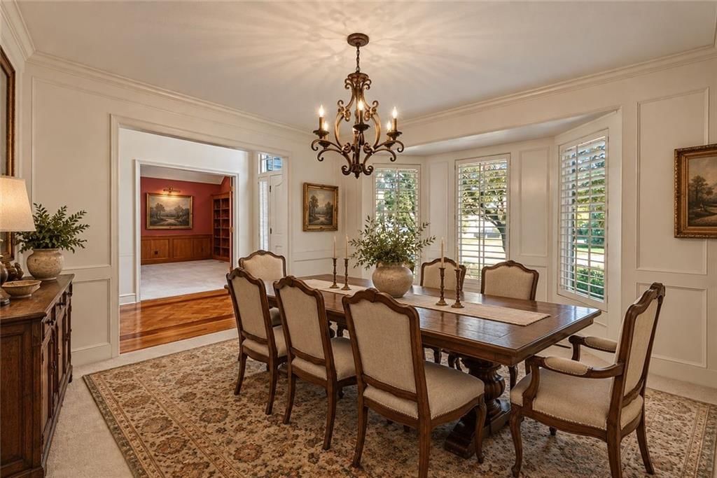 Statement lighting, wainscoting or board and batten and shiplap / paneling at 12808 Sherwood Drive, Leawood, KS 66209