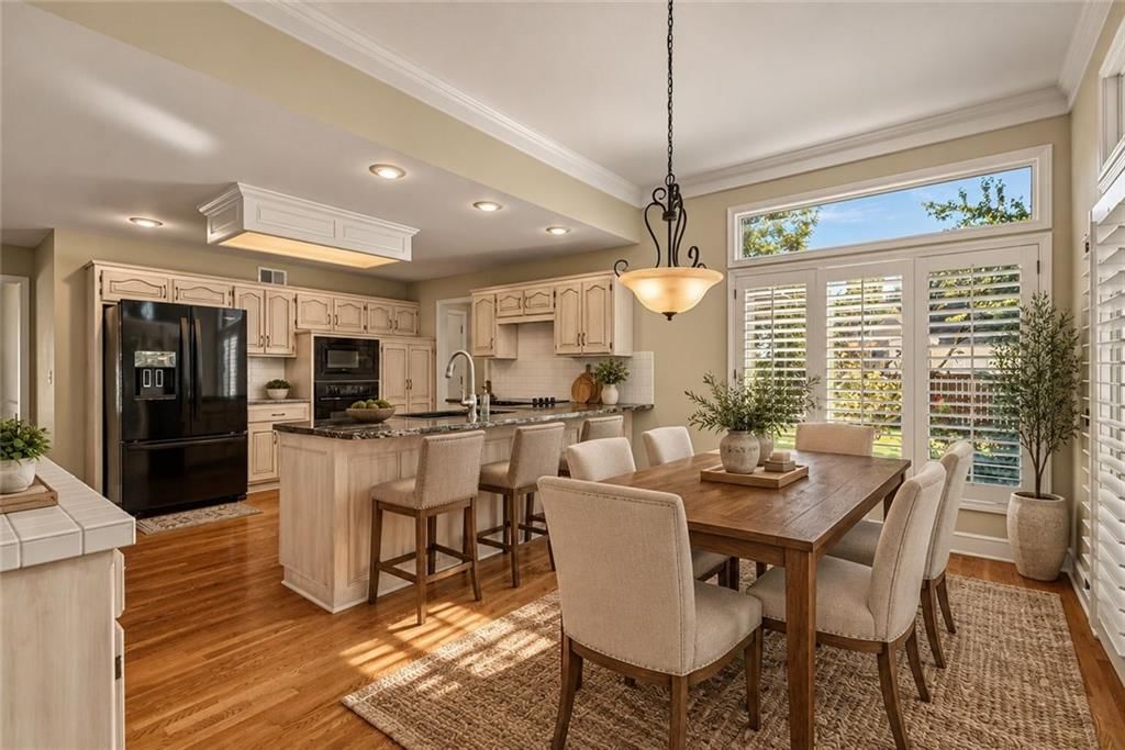 Kitchen island and breakfast nook at 12808 Sherwood Drive, Leawood, KS 66209