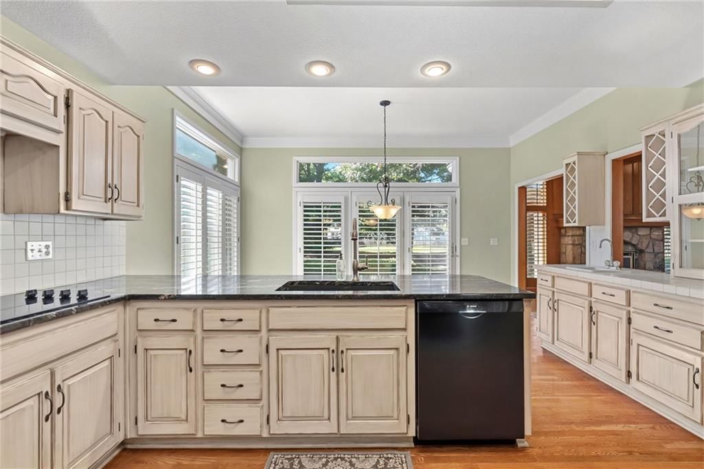 Open floor plan, double oven and electric range at 12808 Sherwood Drive, Leawood, KS 66209
