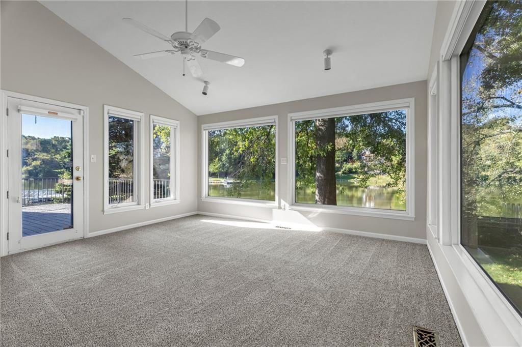 Sunroom and wall of windows at 3806 NE Beechwood Drive, Lee's Summit, MO 64064