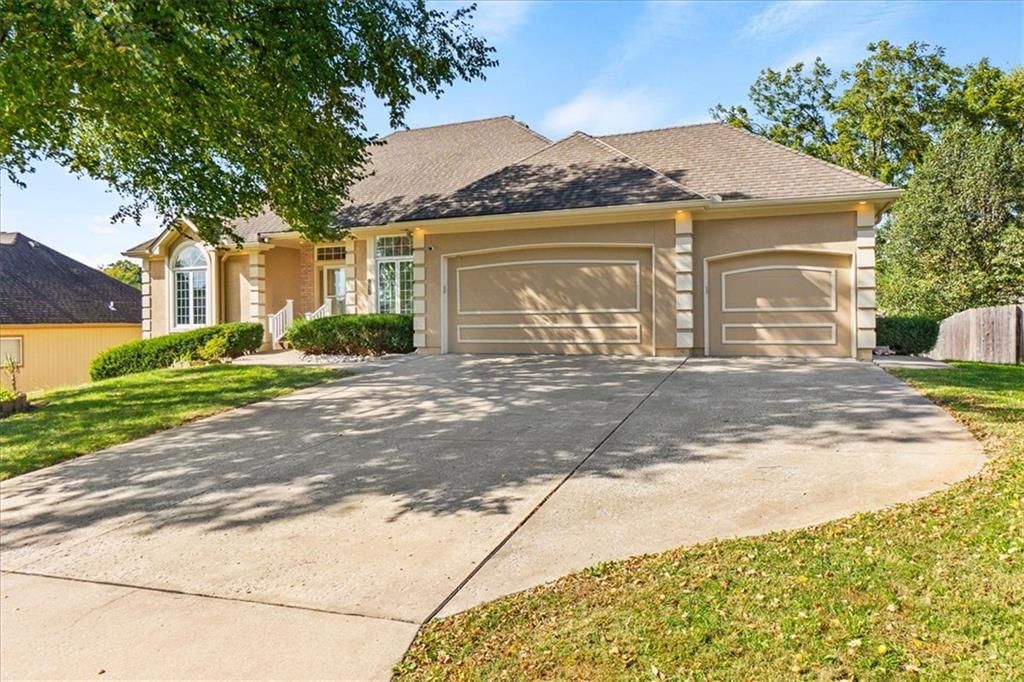 Attached garage and concrete driveway at 3730 S Milton Drive, Independence, MO 64055