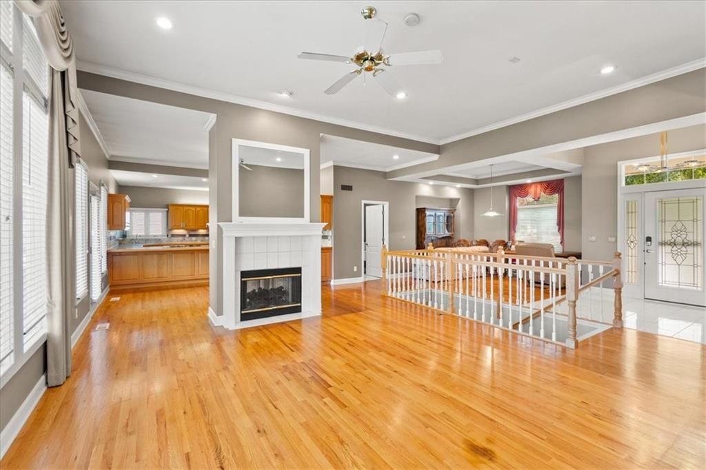 Fireplace, open floor plan and hardwood floors at 3730 S Milton Drive, Independence, MO 64055