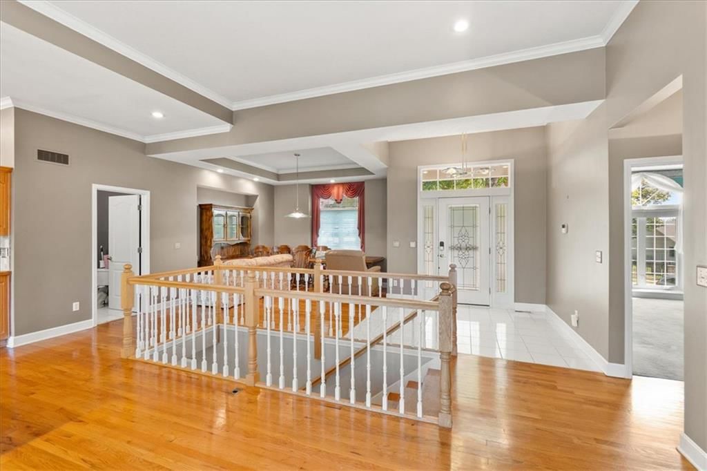 Staircase and wood stair railing at 3730 S Milton Drive, Independence, MO 64055