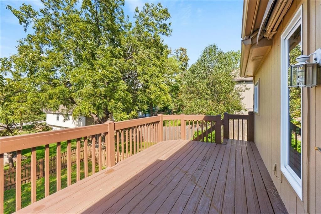 Deck, big backyard and fenced yard at 3730 S Milton Drive, Independence, MO 64055