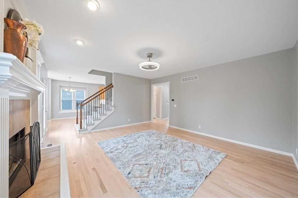 Staircase and wood stair railing at 10138 Theden Circle, Lenexa, KS 66220