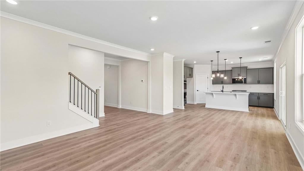 Kitchen island, statement lighting and covered patio at 16748 S Allman Road, Olathe, KS 66062
