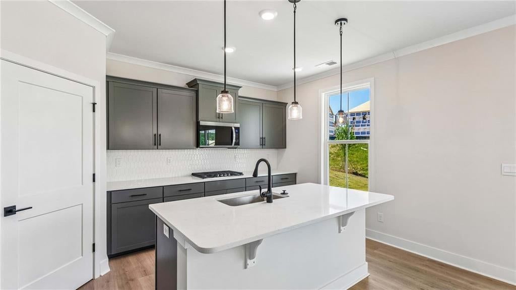 Gas range, double oven and stainless steel appliances at 16748 S Allman Road, Olathe, KS 66062