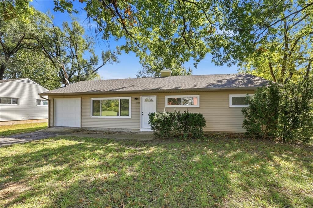 Corner lot, mature trees and attached garage at 11235 Bristol Terrace, Kansas City, MO 64134