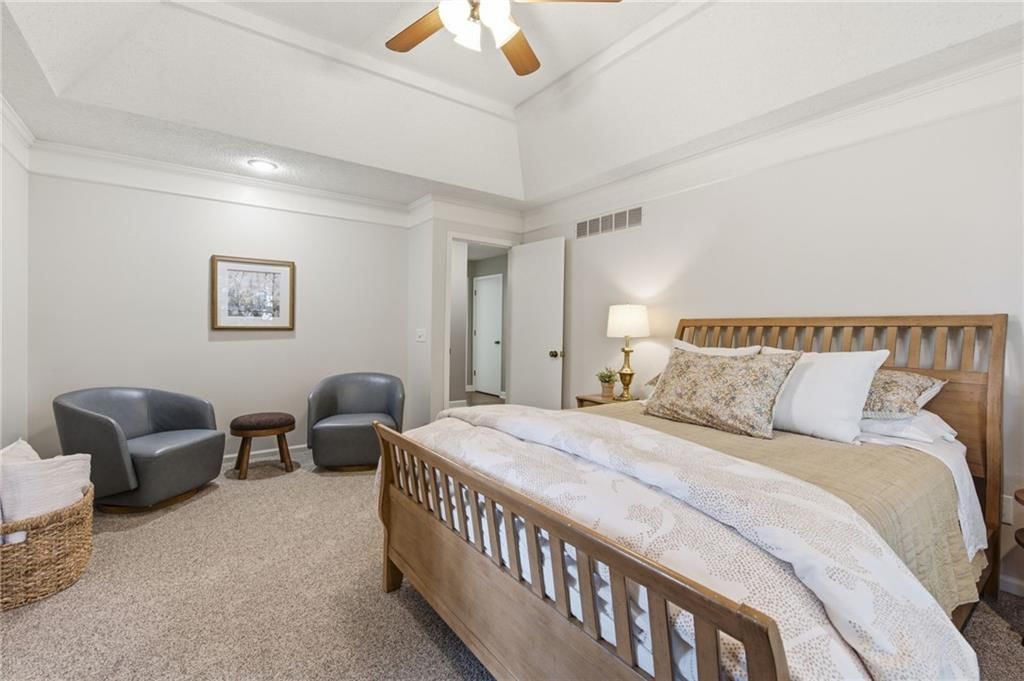 Main-floor primary bedroom and tray ceiling at 11212 W 115TH Street, Overland Park, KS 66210