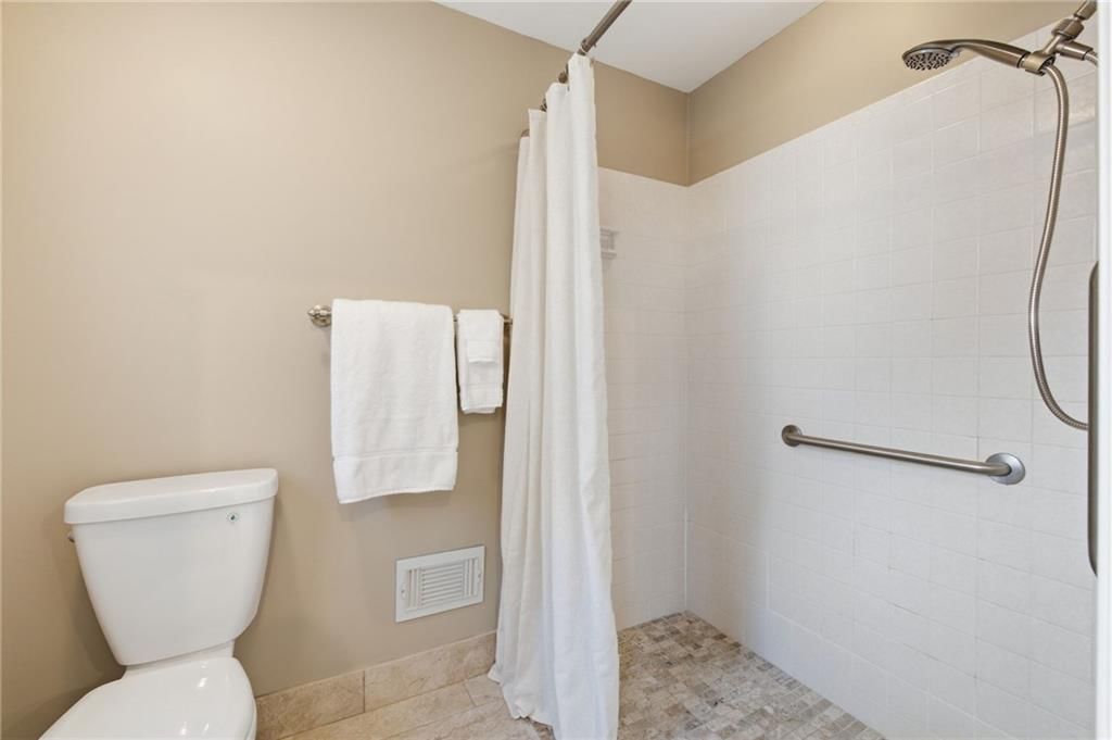 Walk-in shower and tiled shower at 11212 W 115TH Street, Overland Park, KS 66210