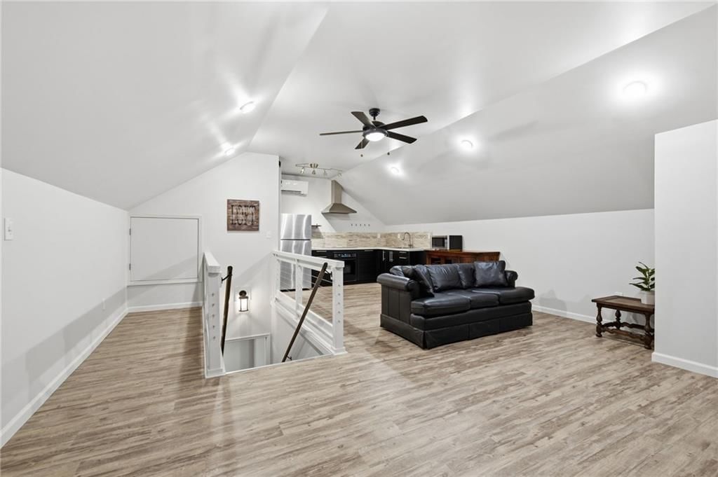 Bonus room, recessed lighting and staircase at 11212 W 115TH Street, Overland Park, KS 66210