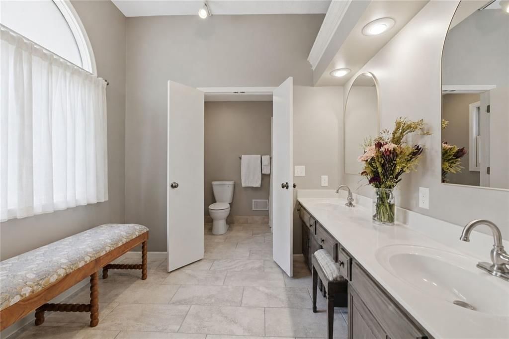 Private toilet room and double vanity at 11212 W 115TH Street, Overland Park, KS 66210
