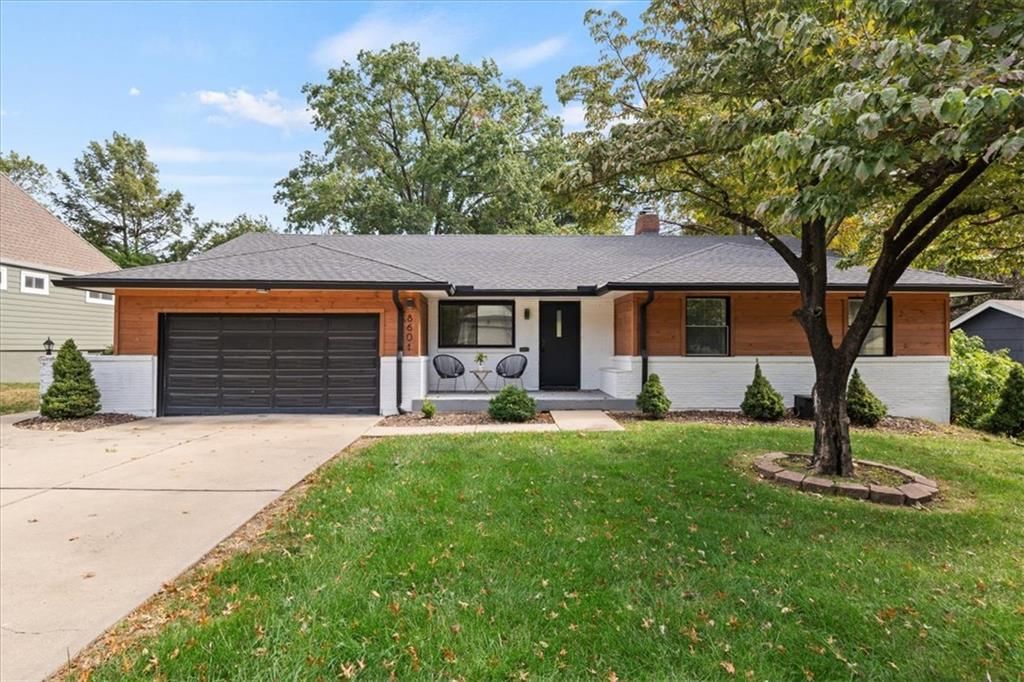 Black exterior windows, attached garage and black roof at 8601 Belleview Avenue, Kansas City, MO 64114