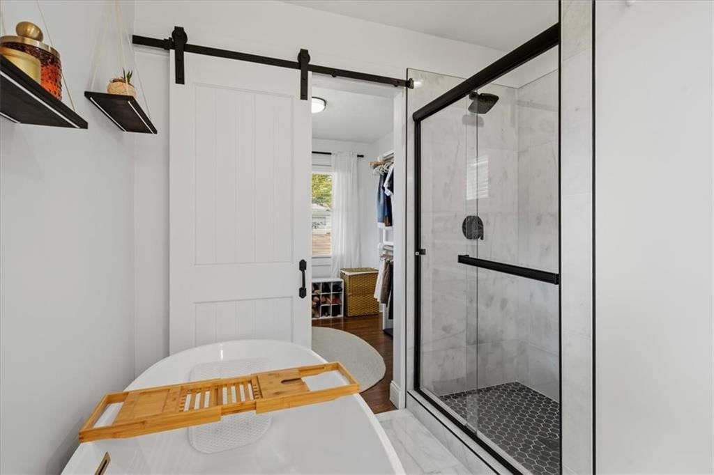 Walk-in shower, tiled shower and frameless glass shower at 8601 Belleview Avenue, Kansas City, MO 64114