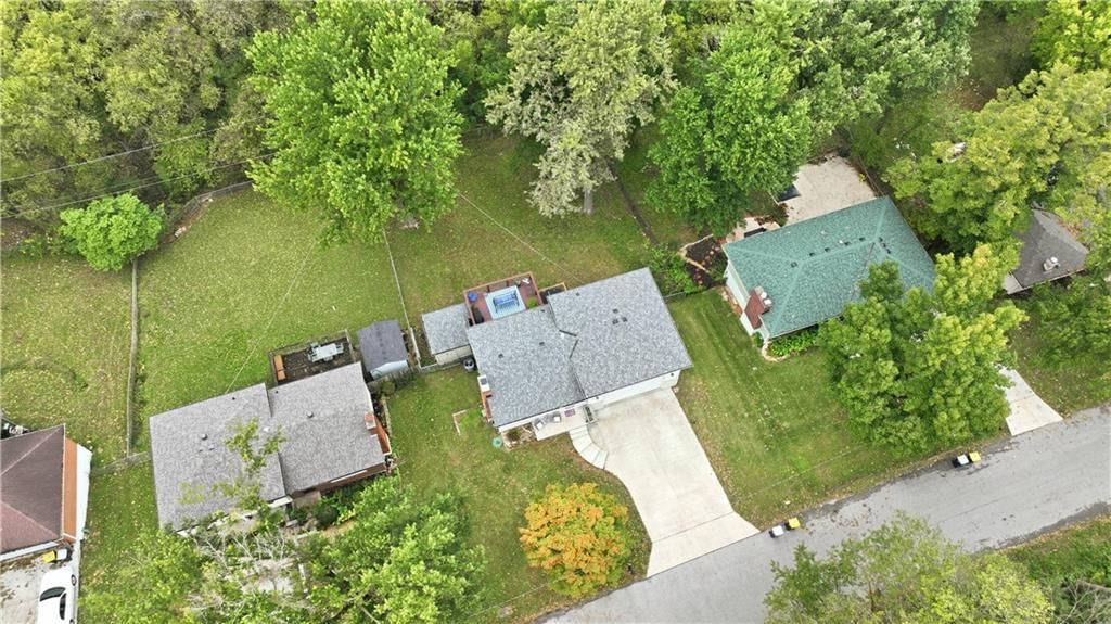 Big backyard, mature trees and flat lot at 8024 NW Cadwallader Road, Kansas City, MO 64152