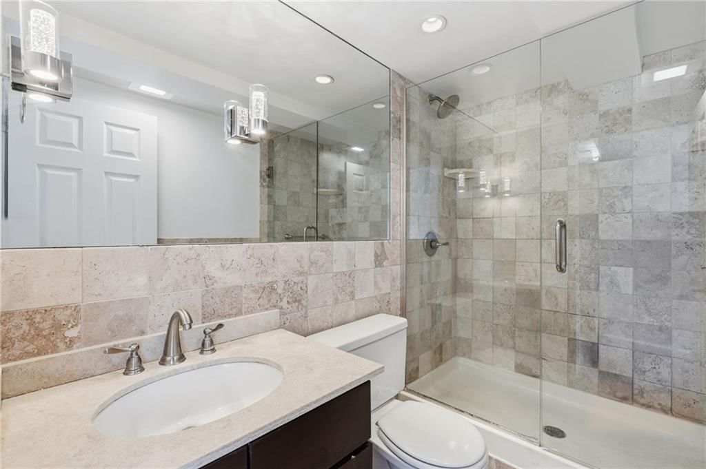 Walk-in shower, tiled shower and frameless glass shower at 3838 Rainbow Boulevard #1011, Kansas City, KS 66103