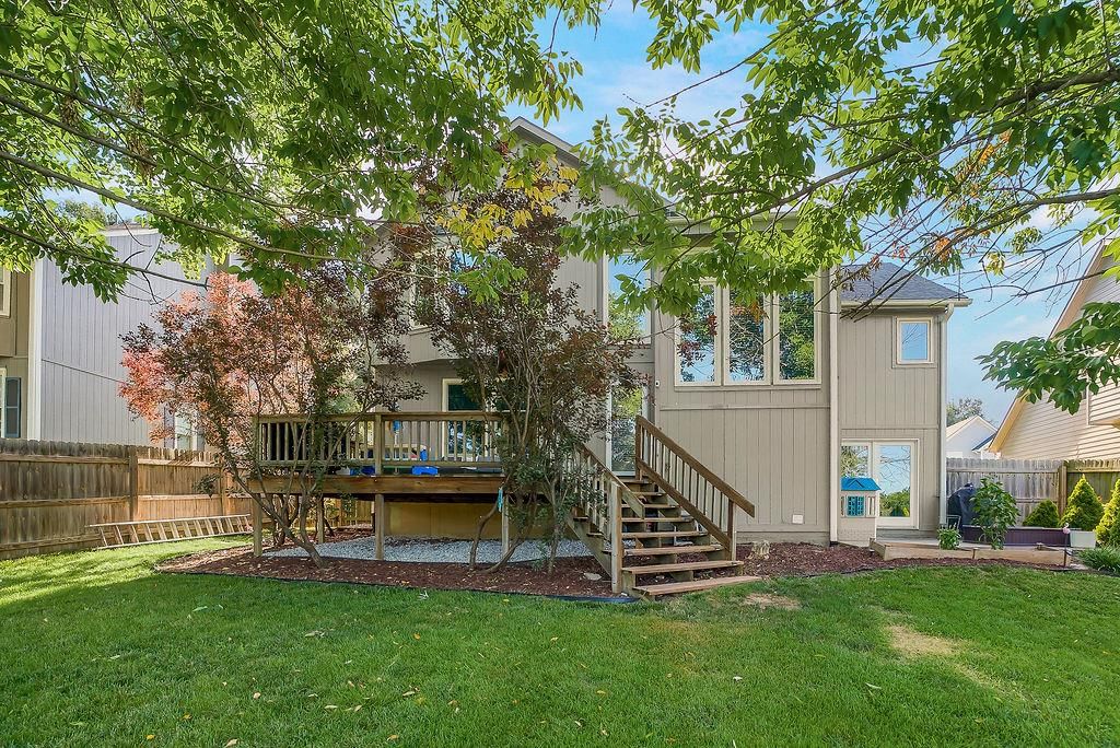 Fenced yard, wood fence and concrete patio at 4732 Chouteau Street, Shawnee, KS 66226