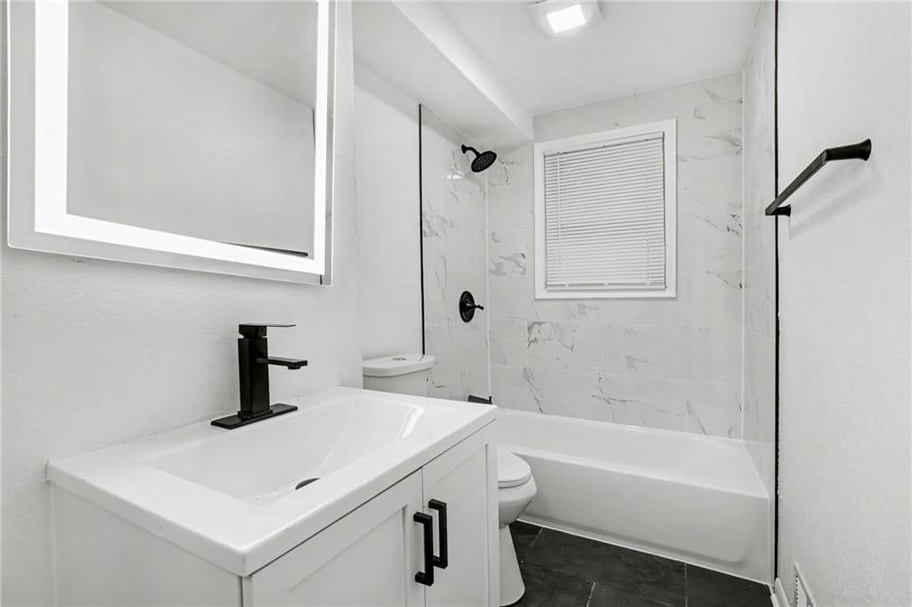 Tiled shower and frameless glass shower at 13512 W 90th Place, Lenexa, KS 66215