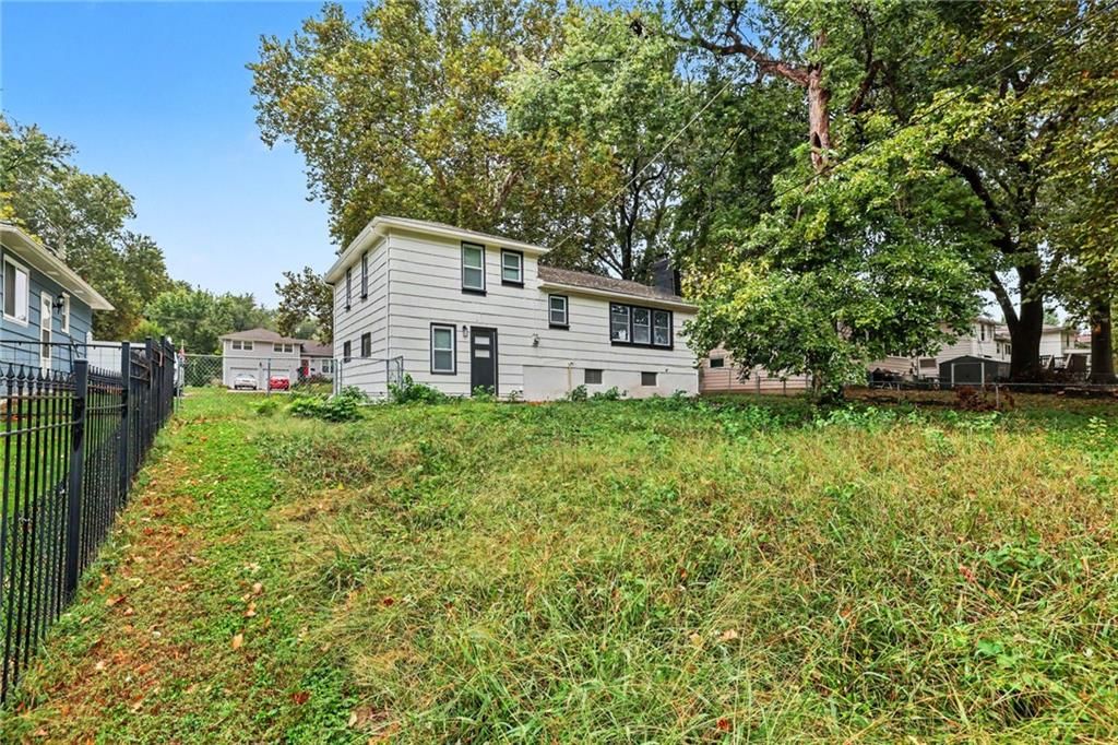 Fenced yard and iron fence at 13512 W 90th Place, Lenexa, KS 66215