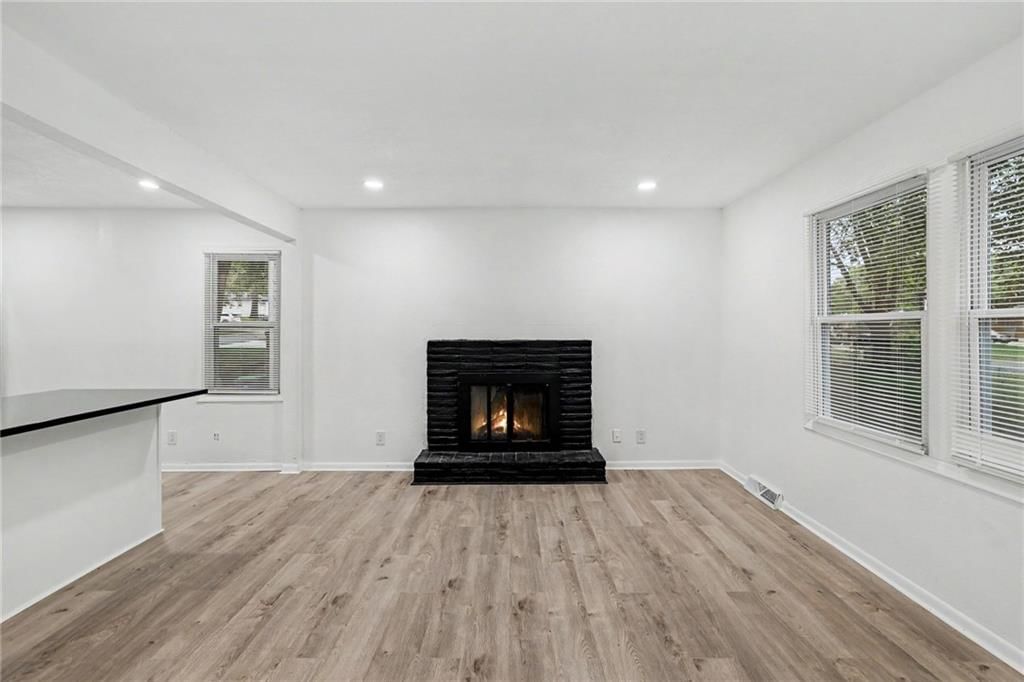 Fireplace and brick fireplace at 13512 W 90th Place, Lenexa, KS 66215