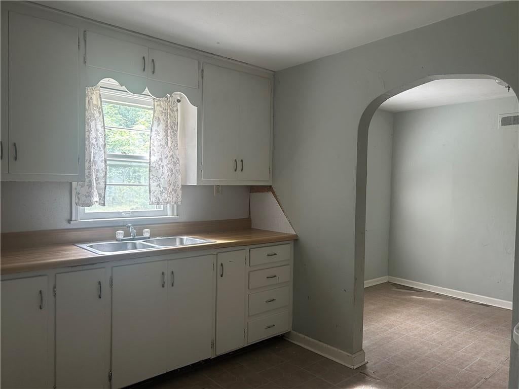 White kitchen and beige or brown countertops at 6601 Farrow Avenue, Kansas City, KS 66104