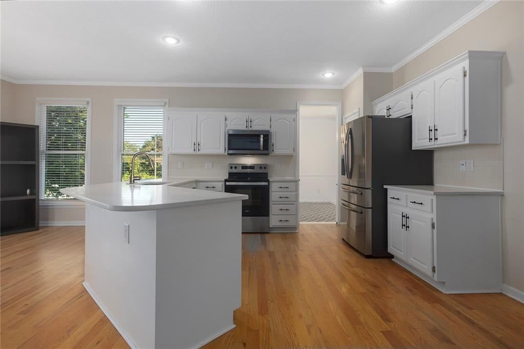 Photo 6: white kitchen cabinets, 13001 Slater Street, Overland Park, KS 66213
