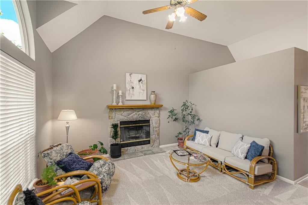 Tall ceilings, fireplace and stone fireplace at 1133 E Charlotte Town Road, Olathe, KS 66061