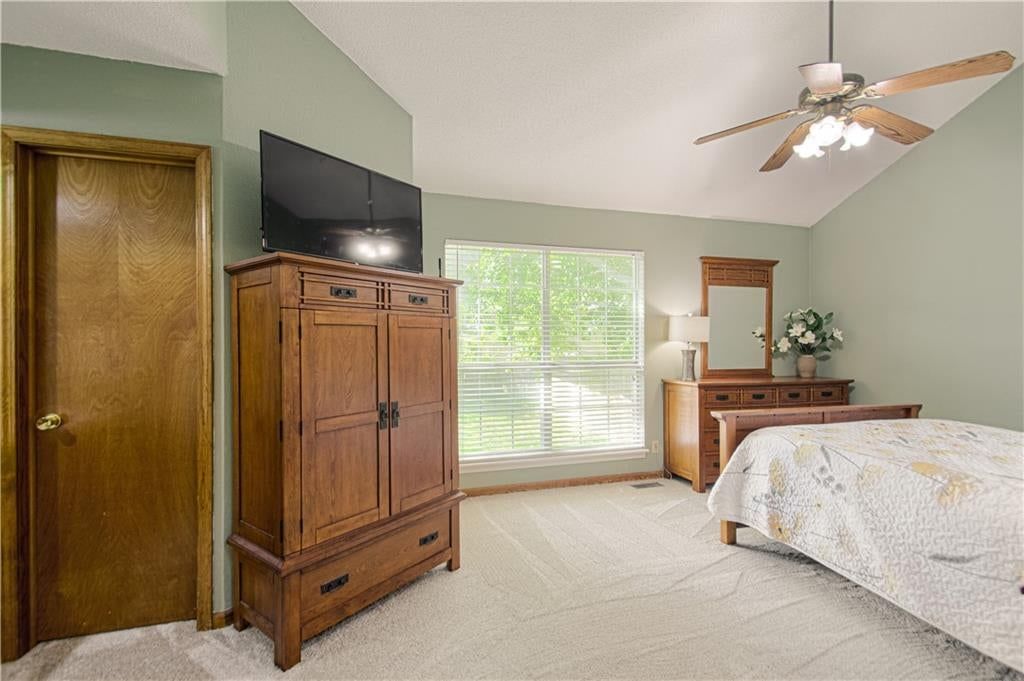 Main-floor primary bedroom at 1133 E Charlotte Town Road, Olathe, KS 66061