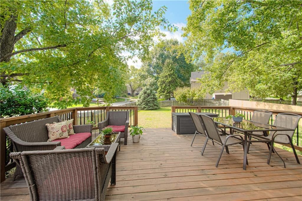 Deck, big backyard and fenced yard at 1133 E Charlotte Town Road, Olathe, KS 66061